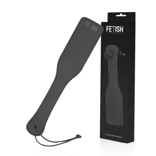 Black paddle with the word "Fetish" written on it and packaging in the background.