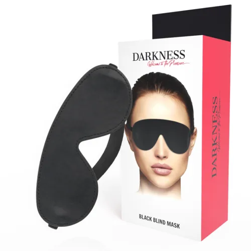 Black eye mask next to packaging with a picture of a person wearing the mask. Text: "Darkness Black Blind Mask".