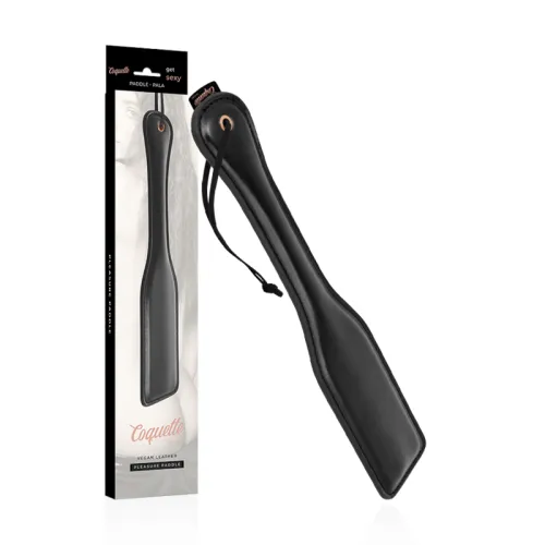 Black vegan leather paddle with packaging, inscription "Coquette".