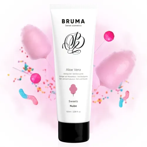 Tube of aloe vera gel surrounded by cotton candy, lollipops and colorful sprinkles on a white background.