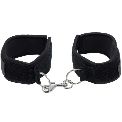 Schwarze Handfesseln mit Klettverschluss und Metallhaken, verbunden durch einen Ring.