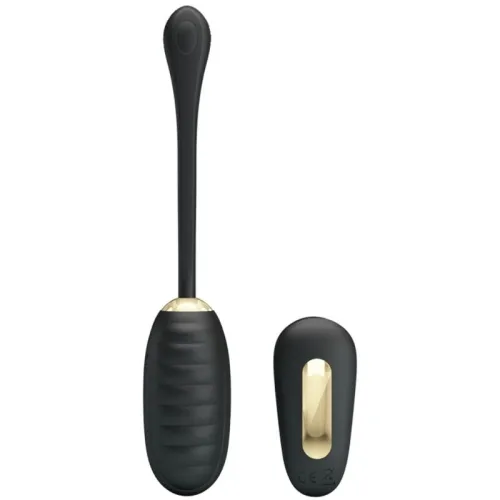 Black, elongated massage device with remote control, gold accents, on a white background.