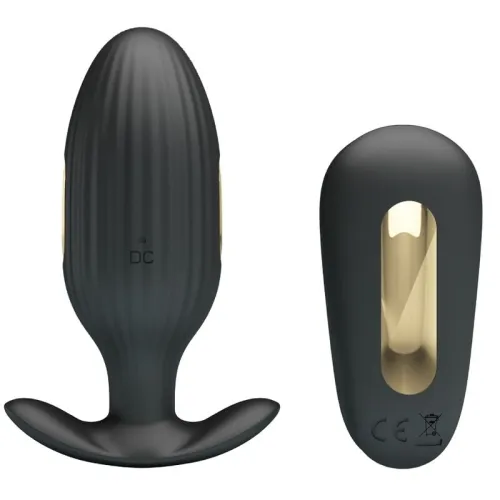 Black, ribbed, oval device with gold accents, next to a matching, rounded accessory.