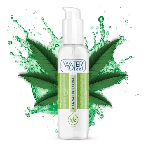 Bottle containing Cannabis Sativa gel, surrounded by green leaves and water splashes.