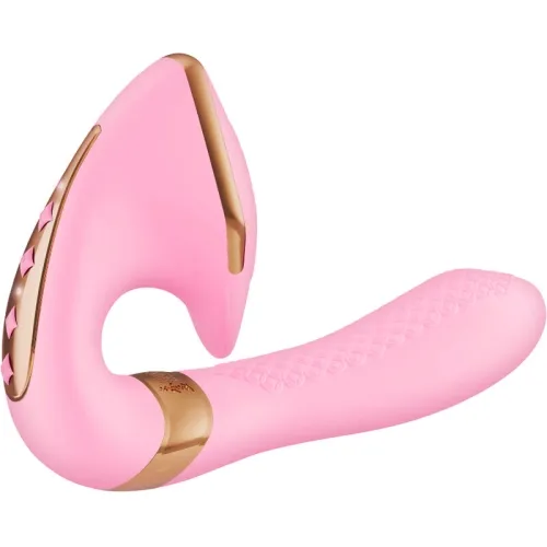 Pink and gold vibrator with curved design and textured handle.