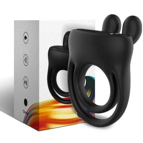 Black silicone vibration ring in front of packaging with a colorful design.