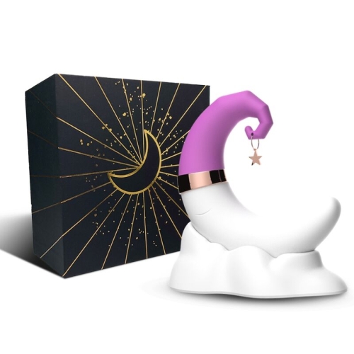 Mondförmiges Objekt mit lila Spitze und Sternanhänger, daneben eine schwarze Box mit goldener Mondgrafik.