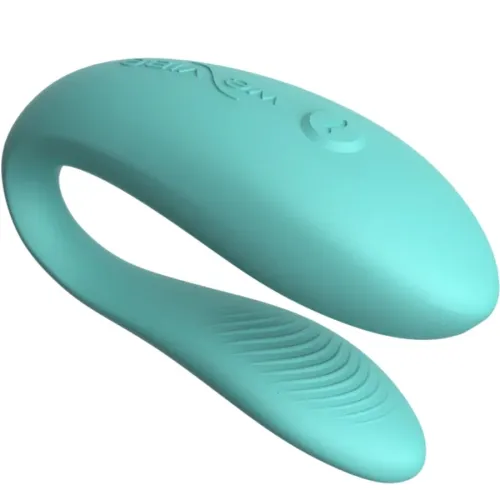 Türkises, gebogenes Silikon-Sextoy mit strukturiertem Ende und Knopf auf der Oberseite.