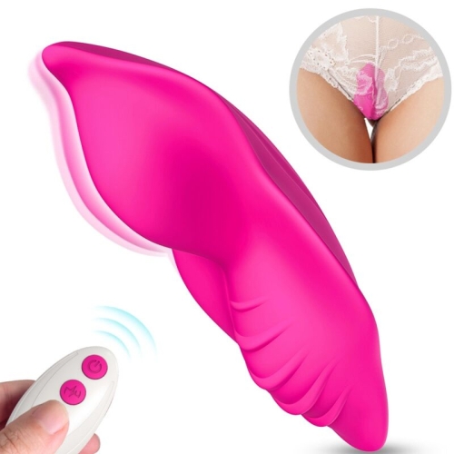 Pink vibrator with remote control, shown in use under lace.