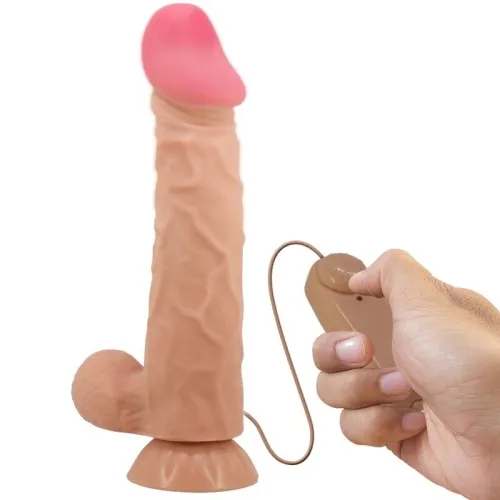 Ein handgehaltener Vibrator mit Fernbedienung in Hautfarbe auf weißem Hintergrund.