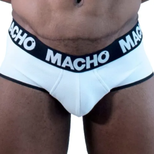 Man wearing white underwear with a black waistband and the word "MACHO" printed on it.