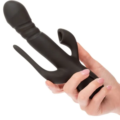 Hand hält schwarzen Vibrator mit mehreren Armen.