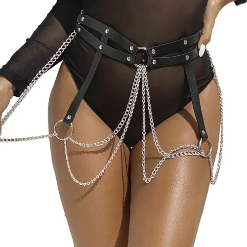 Woman wears black bodysuit with chain and leather belt accessories.