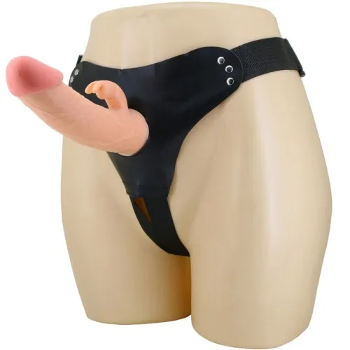 Schwarzer Strap-On mit realistischem Dildo und kleinem Arm auf einem Mannequin.