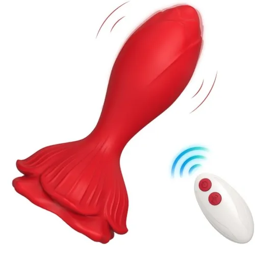 Red, fish-shaped vibrating toy with remote control on a white background.