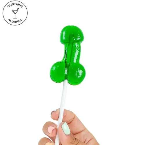 A green lollipop shaped like a penis, held by a hand with colorful nails. Contains alcohol.