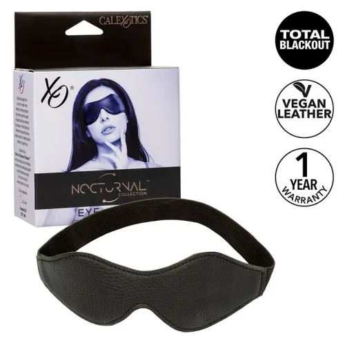 Black eye mask made of vegan leather, packaging with woman, text: "Total Blackout", "Vegan Leather", "1 Year Warranty".
