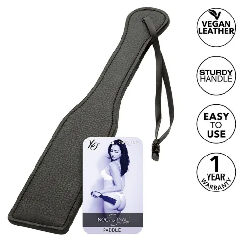 Black paddle made of vegan leather with a sturdy handle, label and warranty seal.