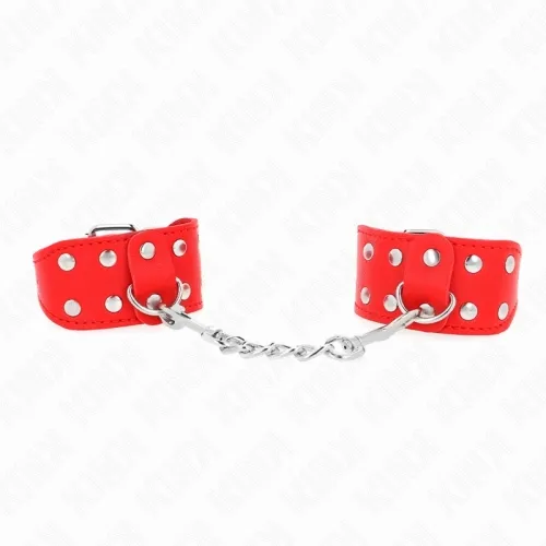 Red handcuffs with silver studs and chain on a white background.