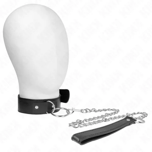 White mannequin with a black collar and chain attached to a leather handle.