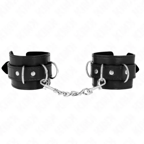 Black leather handcuffs with metal chain and buckles, on a white background.