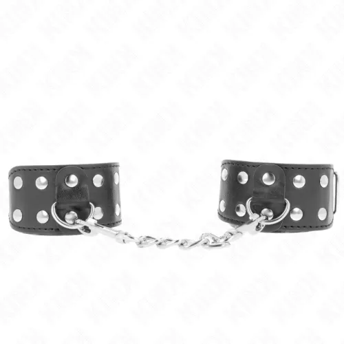 Black leather handcuffs connected with metal rivets and chain.