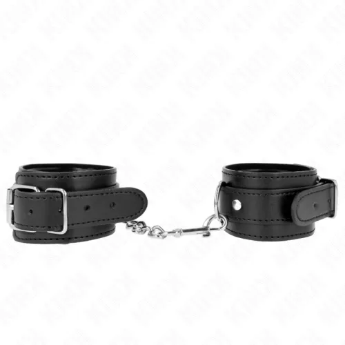 Black leather restraints with buckles and chain, on a white background.