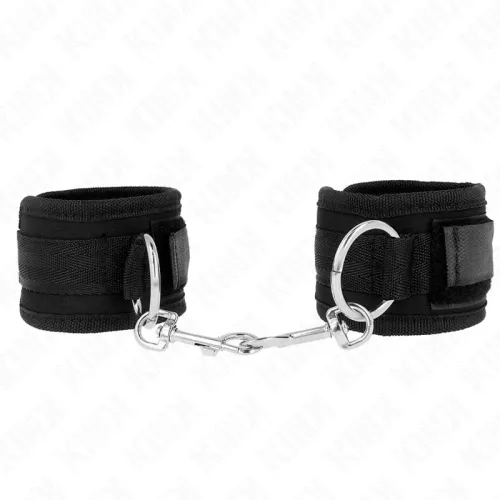 Black handcuffs with metal rings and carabiner hooks, connected by a short chain.