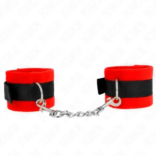 Red plush handcuffs with black ribbon and silver chain, on a white background.