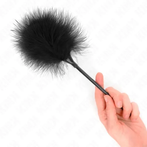 Hand holding a black feather duster on a white background.