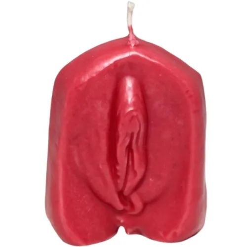 Red candle in the shape of a stylized female body with the wick at the top.