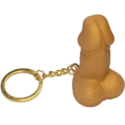 Schlüsselanhänger in Form eines stilisierten, hautfarbenen Objekts mit goldener Kette und Ring.