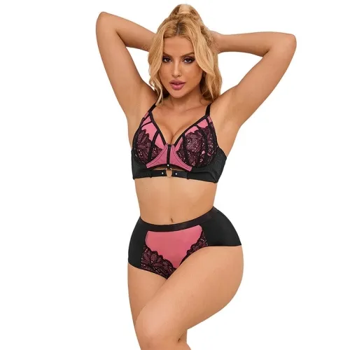 Woman in black and pink lace lingerie, posing with raised arms.