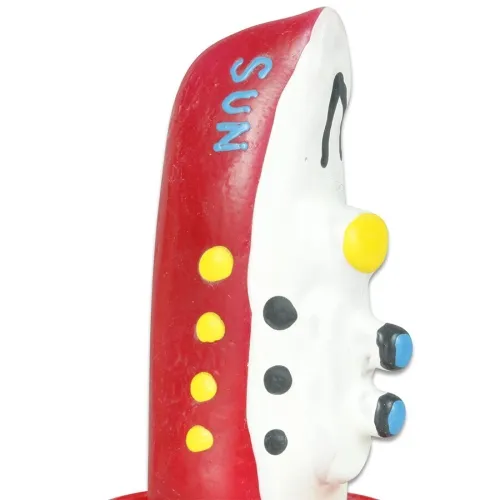 Colorful, abstract sculpture with red, yellow and blue elements, viewed from the side.
