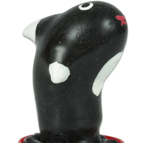 Black and white toy in the shape of an animal with red details, on a white background.