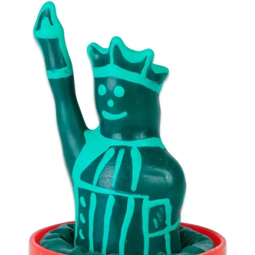 Grüne Knetfigur mit Krone und erhobenem Arm, lächelnd, in einem roten Behälter.