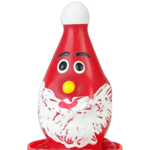 Red candle in the shape of Santa Claus with a yellow nose and white beard.