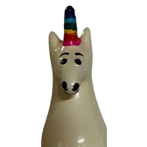 Ceramic unicorn with rainbow horn and friendly facial expression.