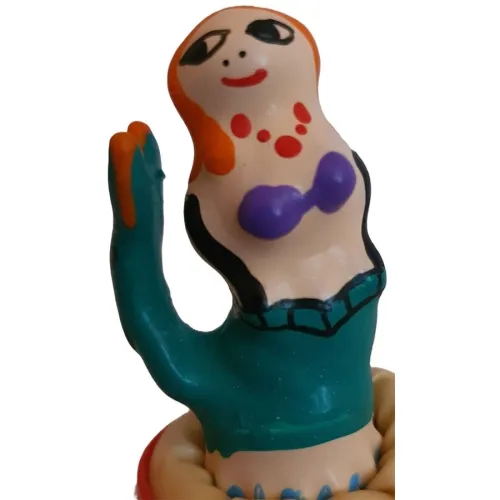 Colorful, handmade figure with red hair, purple top and green skirt, representing a mermaid.