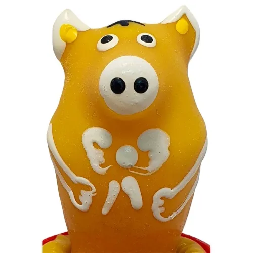 Yellow pig figurine with large eyes and white details on a red base.