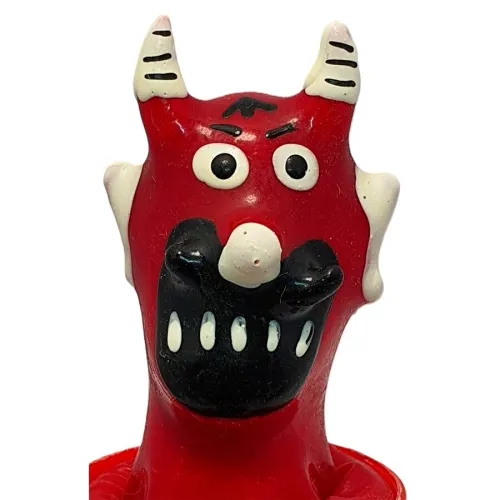 Red devil figure with horns, large eyes and a wide black grin, on a white background.
