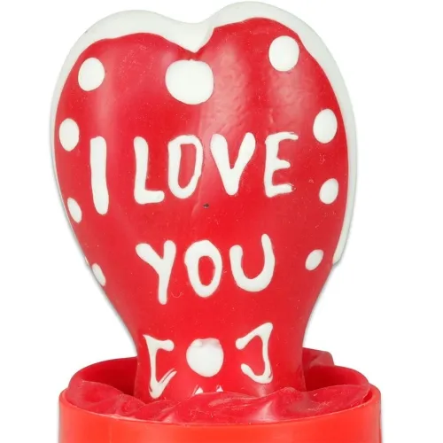 A red heart with white dots and the inscription "I LOVE YOU" in white.
