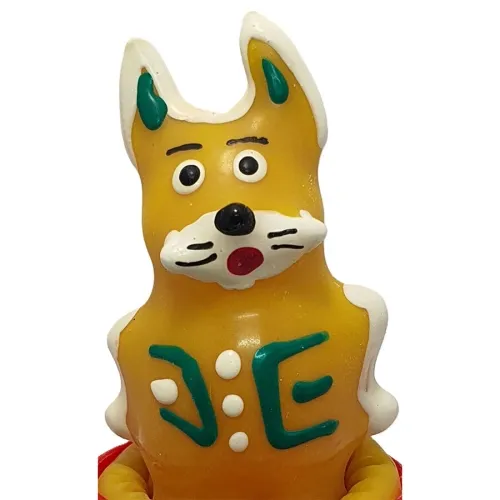 Yellow fox figure with large eyes and green ears, bears the letters "J" and "E" on its chest.