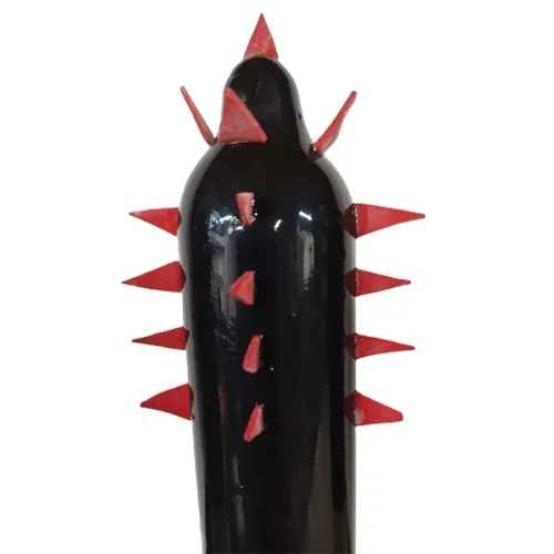 Black object with red, pointed spikes on the sides and top.