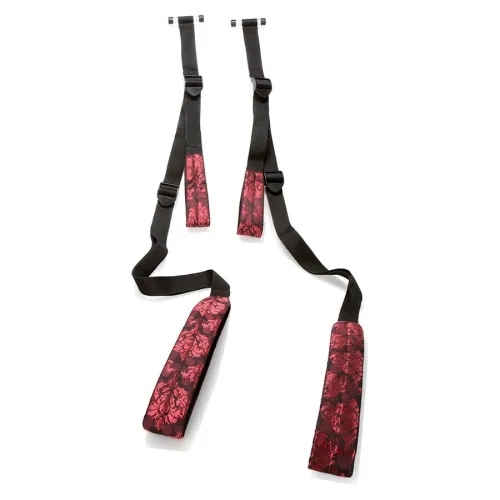 Black straps with red, patterned pads, presumably for fitness or yoga.