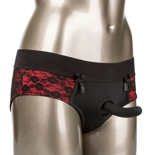 A mannequin is wearing black and red lace lingerie with an attached dildo.