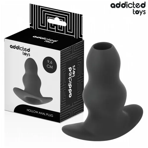 Black, hollow anal plug from Addicted Toys, 9.6 cm, pictured next to the packaging.