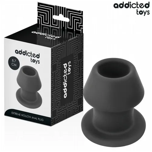Schwarzer, hohler Analplug von Addicted Toys neben der Verpackung, 8,7 cm groß.
