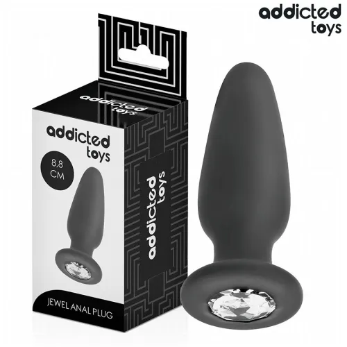 Black anal plug with gemstone, 8.8 cm, next to packaging from Addicted Toys.