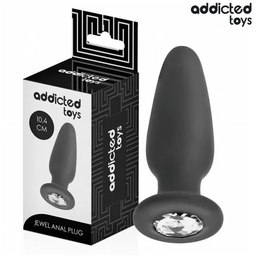 Black anal plug with gemstone, 10.4 cm, next to packaging from Addicted Toys.